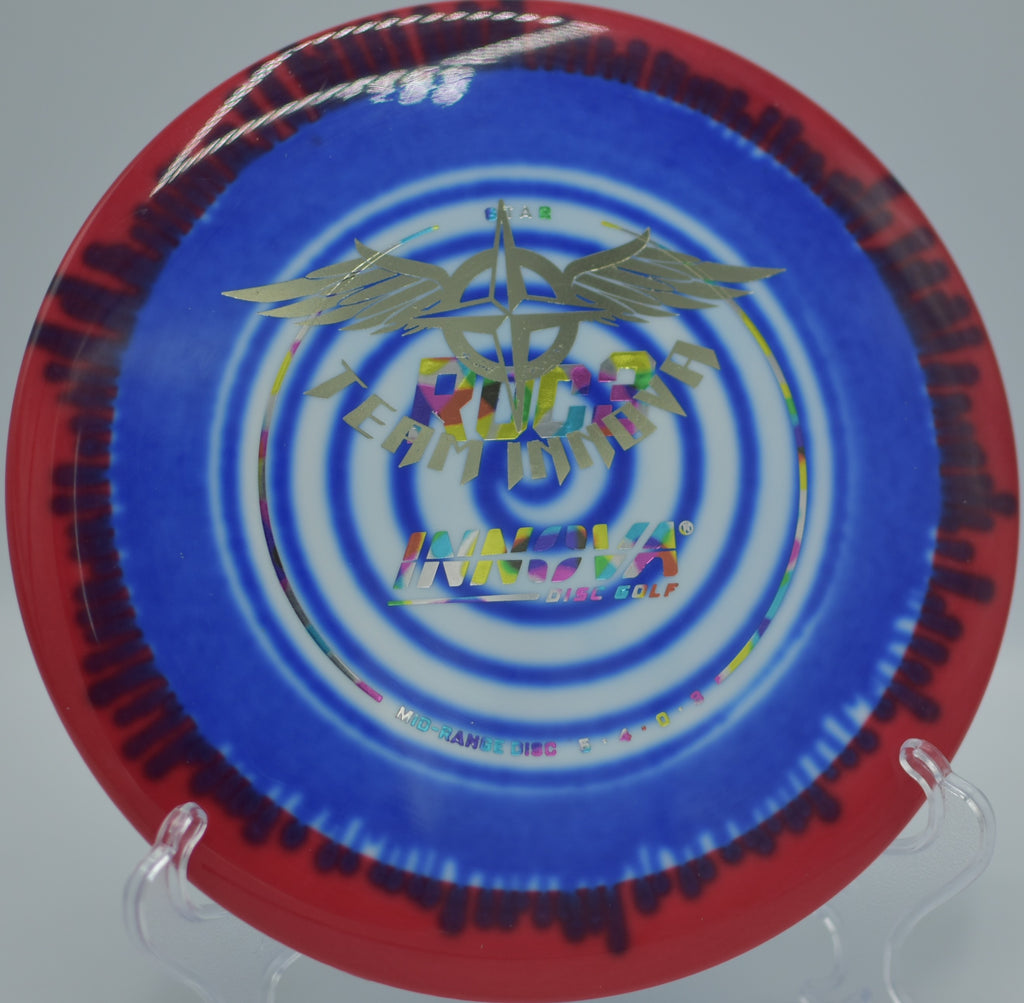 Innova I-Dye Star Roc3 (Team Stamp) spinning toward the target on a precise approach at DeLaveaga Disc Golf Course in Santa Cruz, California.