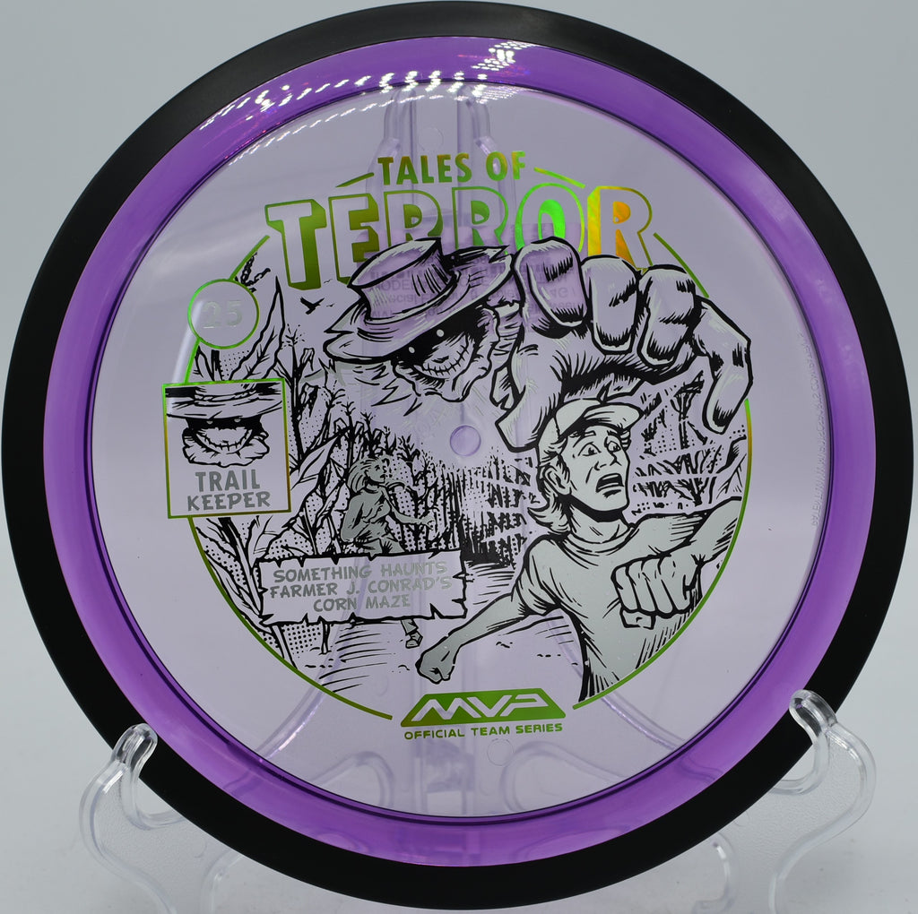 Special edition MVP Proton Trail flying through wooded gap at Idlewild Disc Golf Course in Burlington KY, ideal for shaping long turnovers with reliable fade.