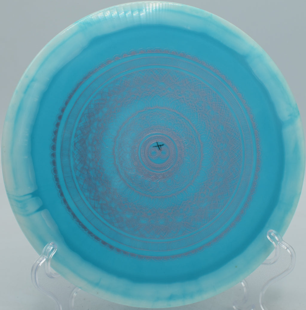 Infinite Discs Halo S-Blend Slab X-Out overstable distance driver ripping a forehand hyzer at Maple Hill Disc Golf Course in Leicester, Massachusetts.