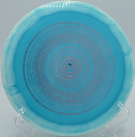 Infinite Discs Halo S-Blend Slab X-Out overstable distance driver ripping a forehand hyzer at Maple Hill Disc Golf Course in Leicester, Massachusetts.