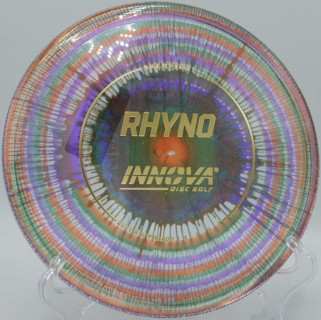 Innova I-Dye Champion Rhyno putter resting near chains after a torque-resistant approach at Green Valley Park Disc Golf Course in Payson, Arizona