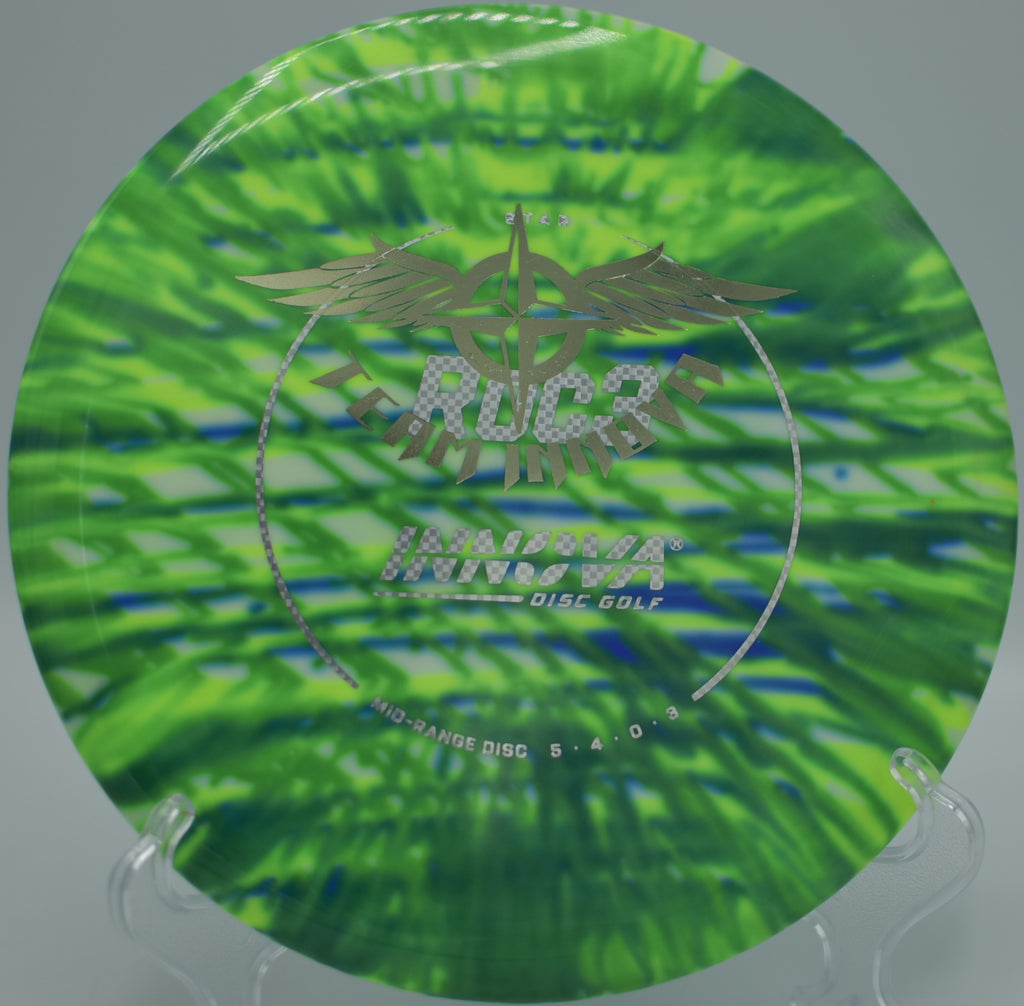 Player throwing an I-Dye Star Roc3 Team Stamp through a wooded tunnel shot at Harmon Hills Disc Golf Course in Fall Branch, Tennessee.