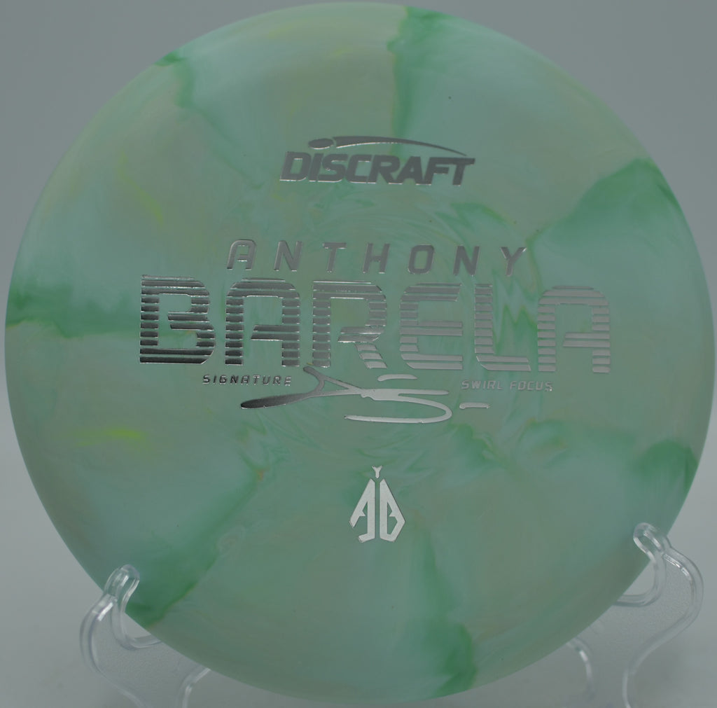 Discraft CT Swirl Focus Anthony Barela Tour putter parked on approach at Sugaw Creek Disc Golf Course in Charlotte, North Carolina.