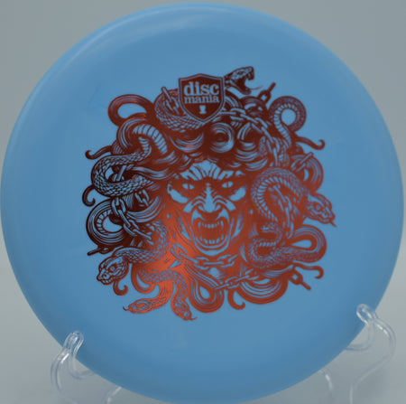 Discmania Soft Lumen Link Medusa beaded putter glowing bright under UV light at Fox Run Meadows Disc Golf Course in Jeffersonville, Vermont.