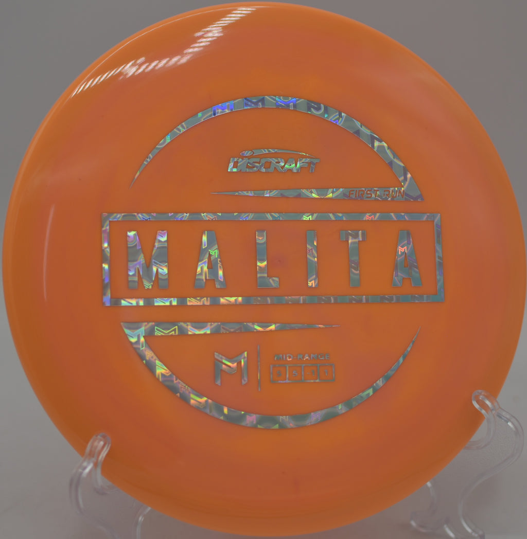 Discraft First Run ESP Malita mid-flight on a clean turnover at The Fort Disc Golf Course in Ogden, Utah.