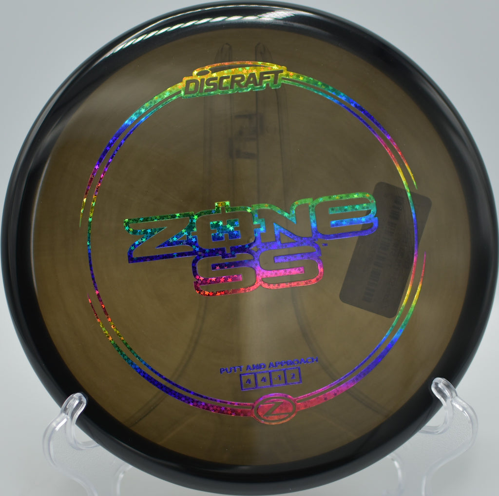 Discraft Z Zone SS gliding with perfect control through a wooded fairway at Black Mouse Disc Golf Course in Felton, California.