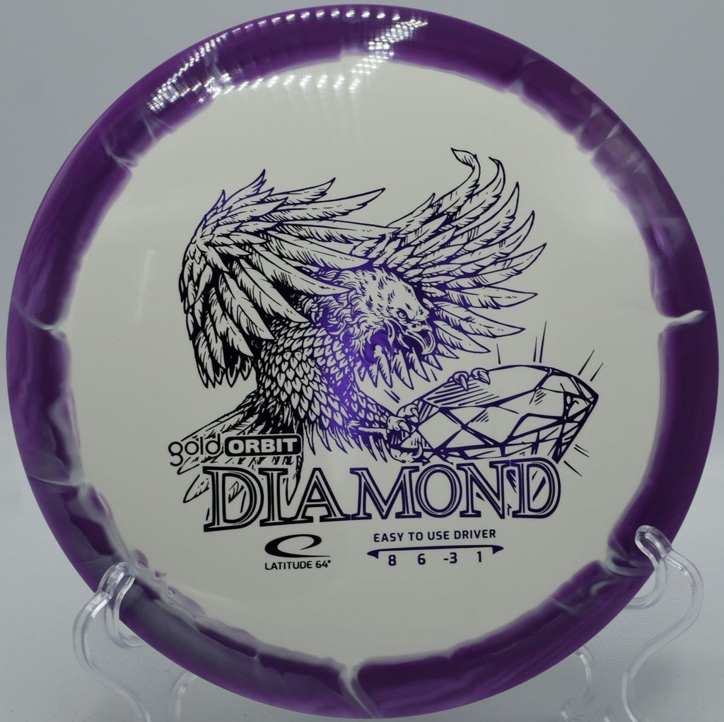 Gold Orbit Diamond beginner disc golf driver on dirt fairway at Panther Creek Disc Golf Course in Springfield, Illinois