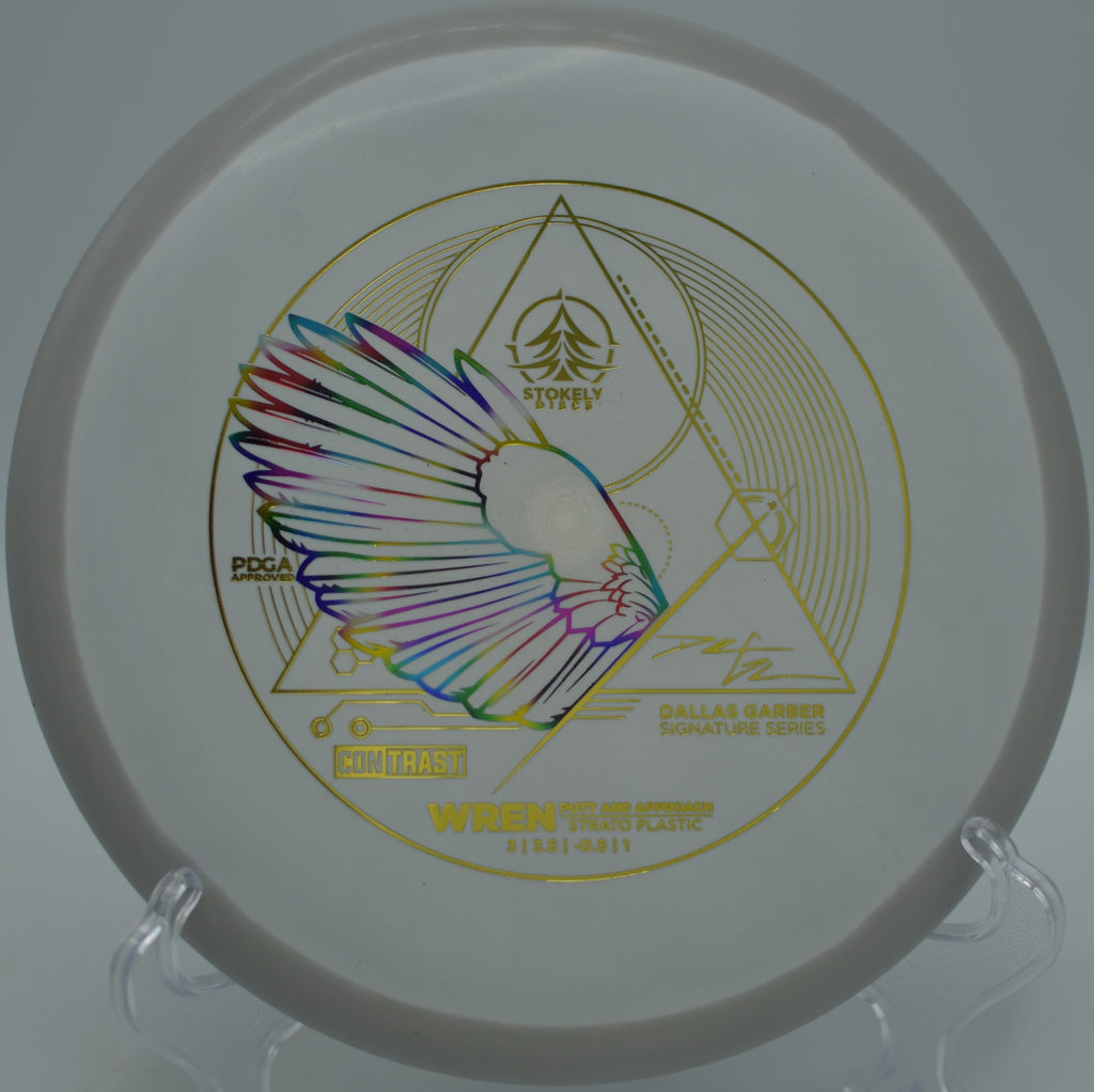 Stokely Discs Dallas Garber Signature Strato Wren resting near the cage after a smooth finish at The Claytons Disc Golf Course in Alcoa, Tennessee.