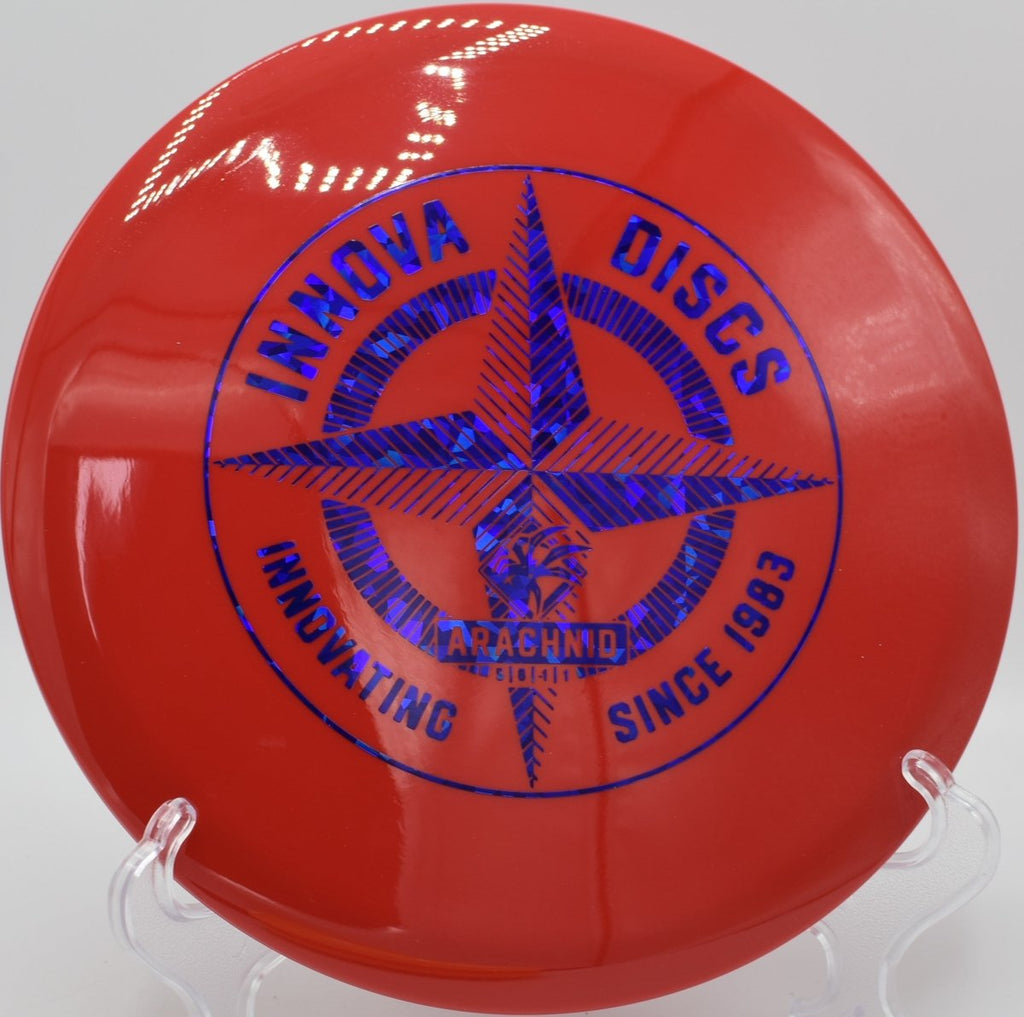 Protostar Arachnid midrange staged for a straight tunnel shot at Willow Creek Disc Golf Course in Sunnyvale, California