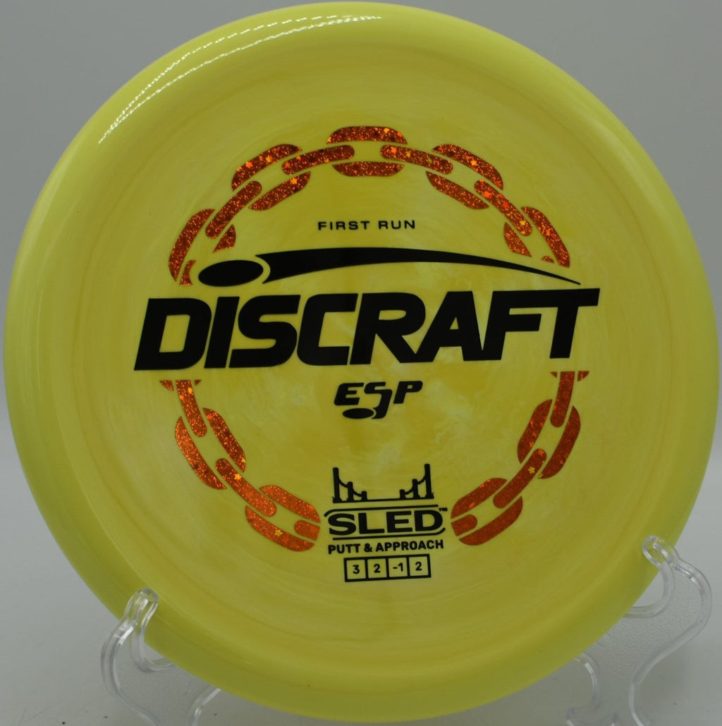 Discraft First Run ESP Sled stable putter landing near chains at Rosedale Park Disc Golf Course in Kansas City, Kansas