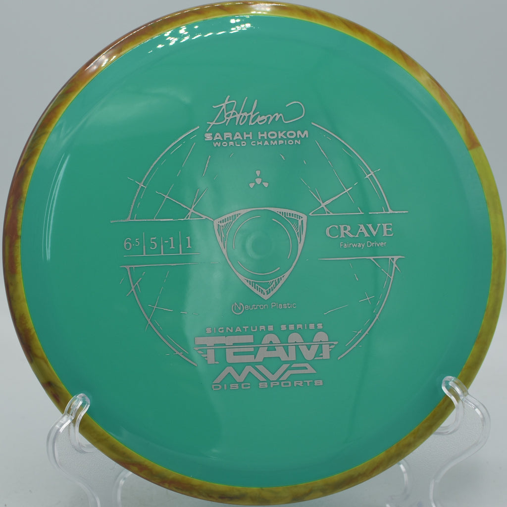 MVP Neutron Crave gliding down a wooded tunnel fairway at Maple Hill Disc Golf Course in Leicester, Massachusetts.