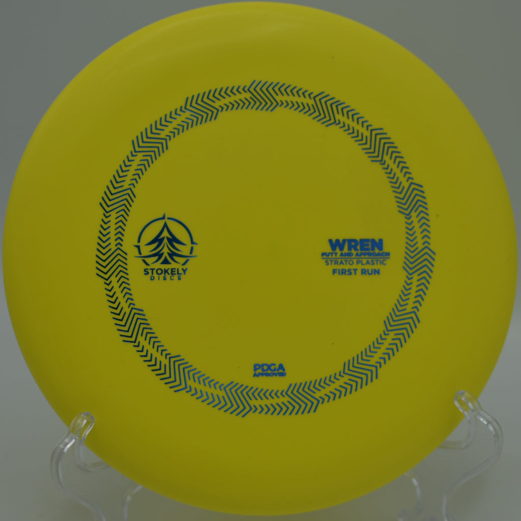 Stokely Discs Strato Wren gliding toward the chains on a straight putt at Hudson Mills Metropark Disc Golf Course in Dexter, Michigan.