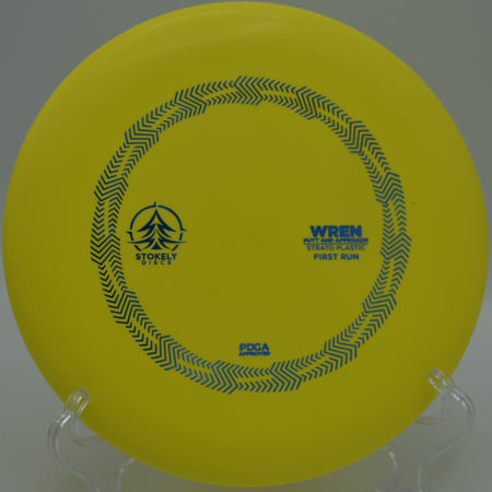 Stokely Discs Strato Wren gliding toward the chains on a straight putt at Hudson Mills Metropark Disc Golf Course in Dexter, Michigan.