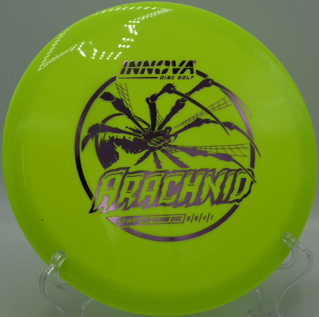 Innova Star Arachnid midrange staged on tee pad for a precision line at Cedar Grove Disc Golf Course in Fairmont, West Virginia