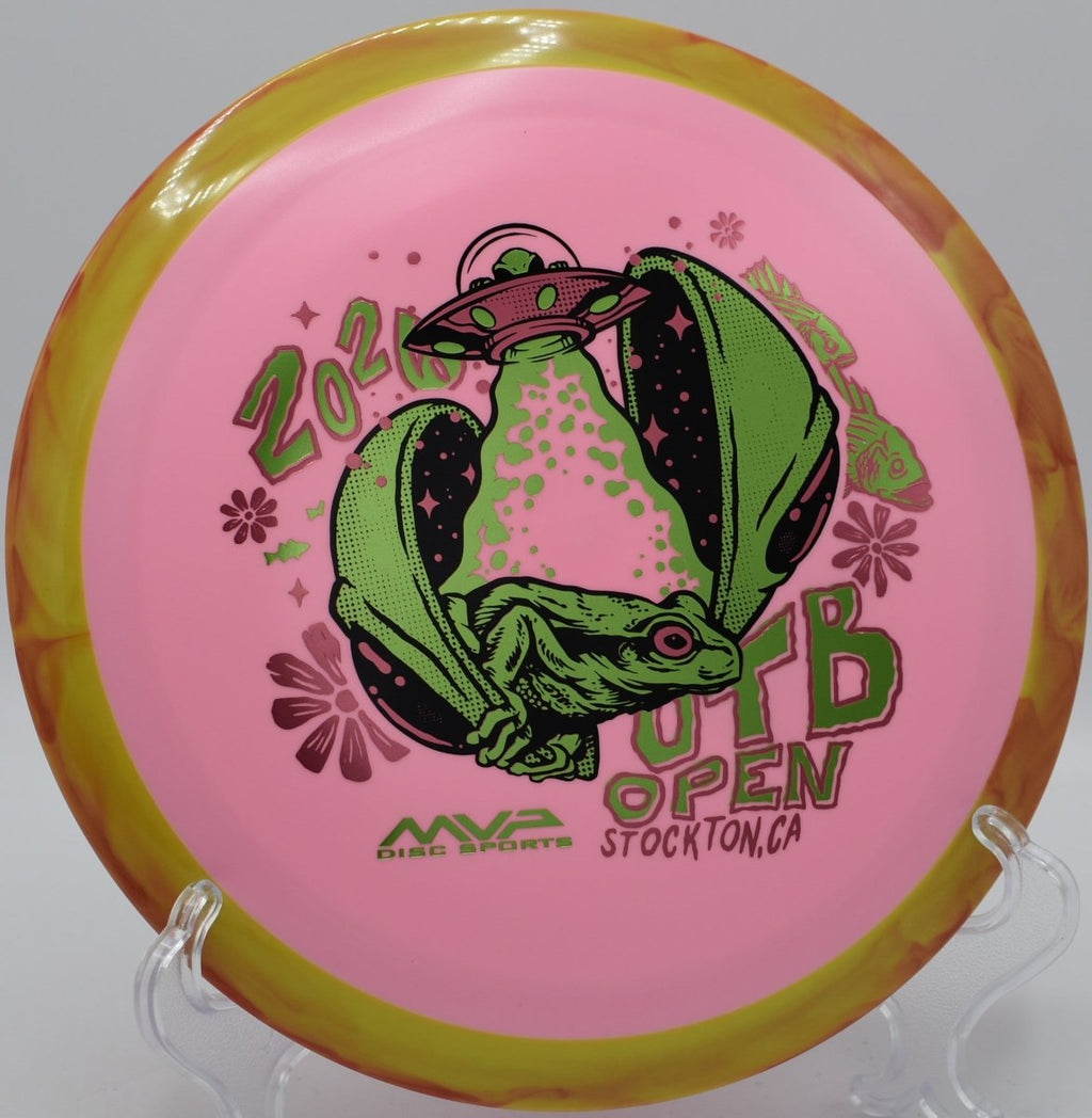 Axiom OTB Open Fission Delirium driver displayed on open field fairway at Jones Park Disc Golf Course in Emporia, Kansas