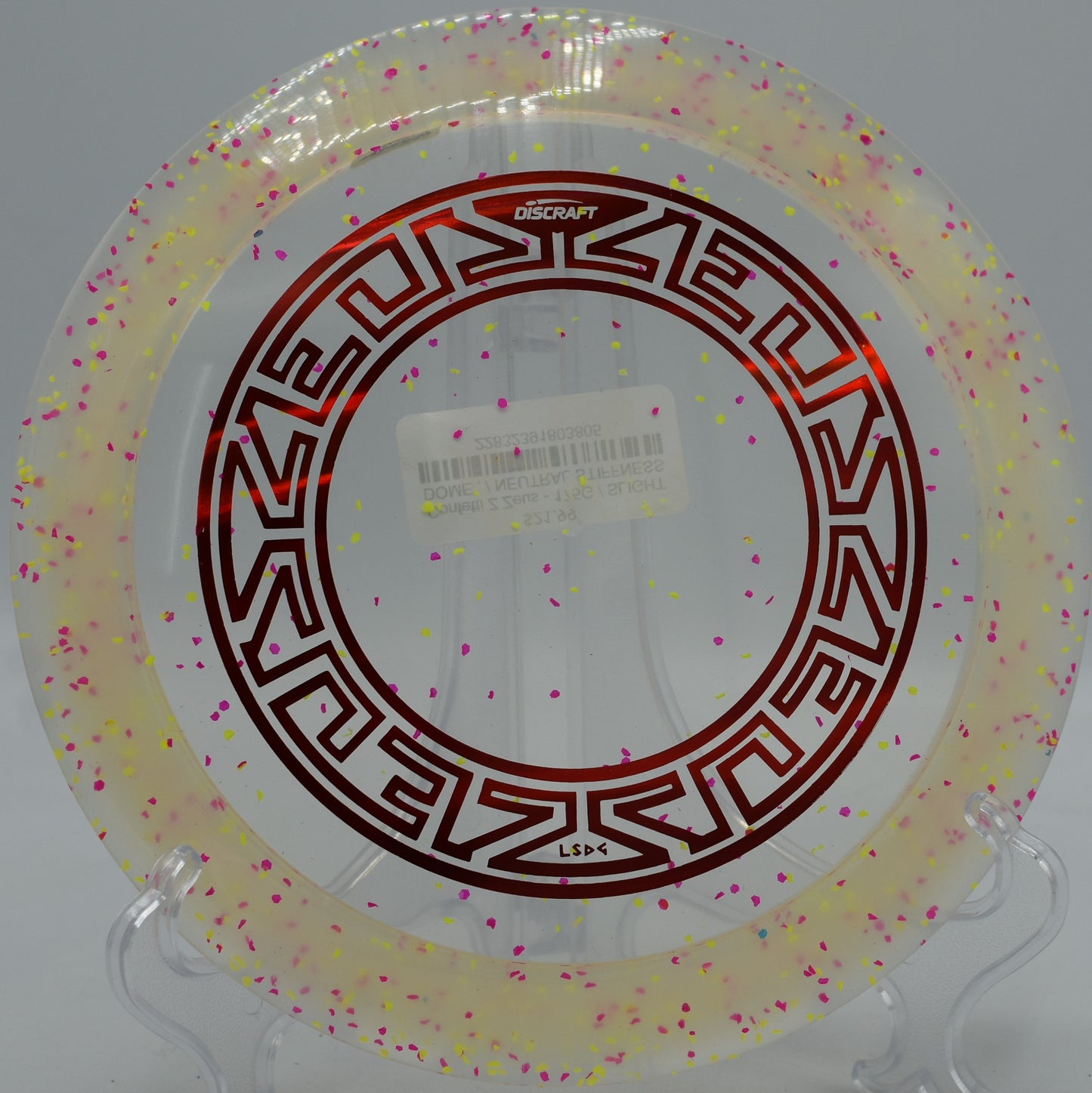 Z Confetti Zeus glowing under bright sun at North Cove Disc Golf Course in Marion, North Carolina