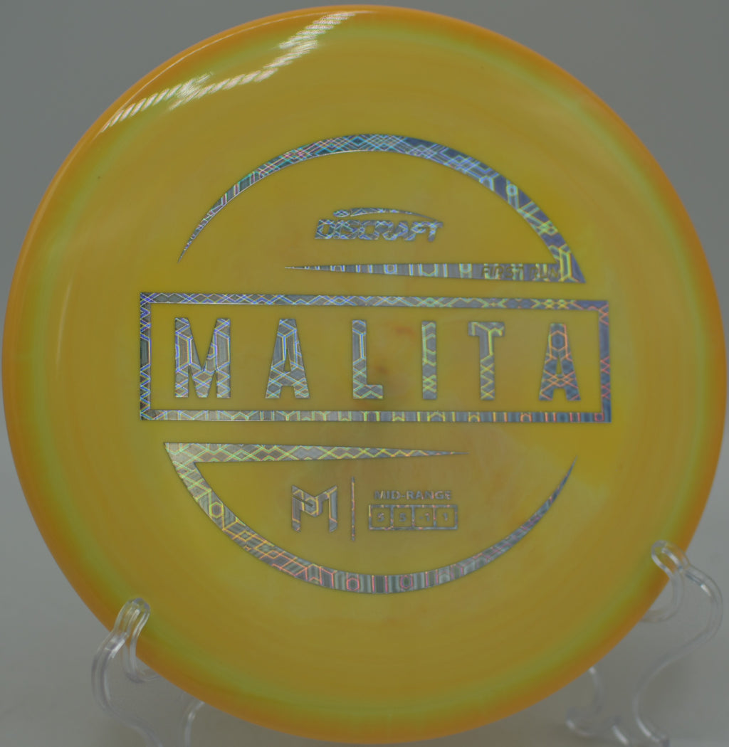 Player gripping the McBeth Malita midrange for a precise approach at Cedar Hill Disc Golf Course in Nashville, Tennessee.