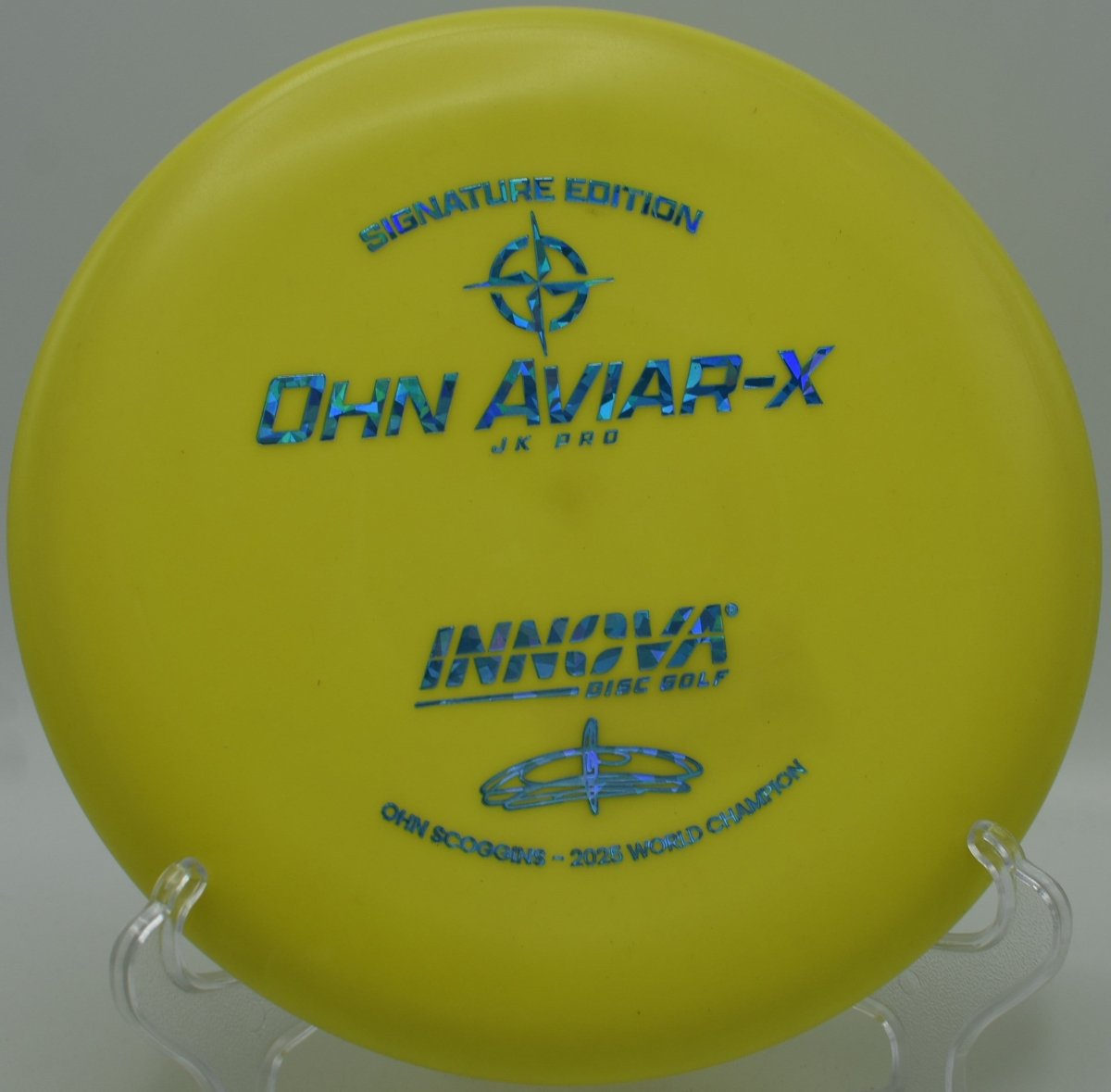 Innova JK Aviar-X putter positioned for a straddle putt at Zilker Park Disc Golf Course in Austin, Texas