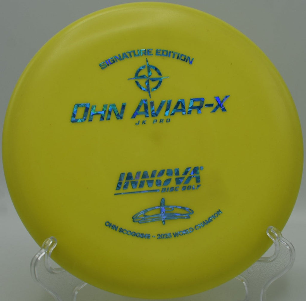 Innova JK Aviar-X putter positioned for a straddle putt at Zilker Park Disc Golf Course in Austin, Texas