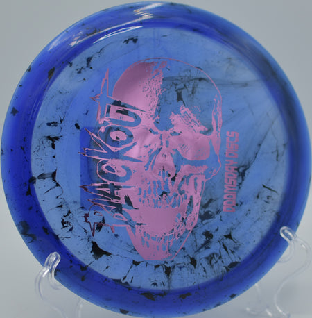 Biohazard Blackout hyzer-flipping through a tight tunnel at Blue Angel Park DGC in Pensacola, FL, gliding straight before a gentle fade.