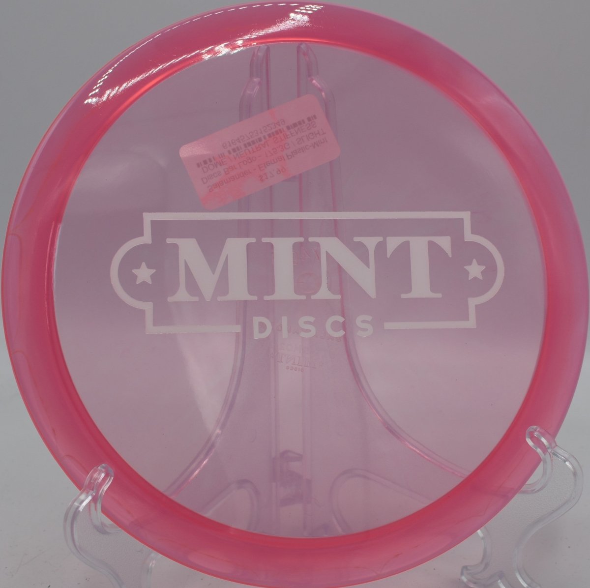 Mint Discs Eternal Salamander fairway driver gliding clean through tunnel at Nevin Park Disc Golf Course in Charlotte North Carolina