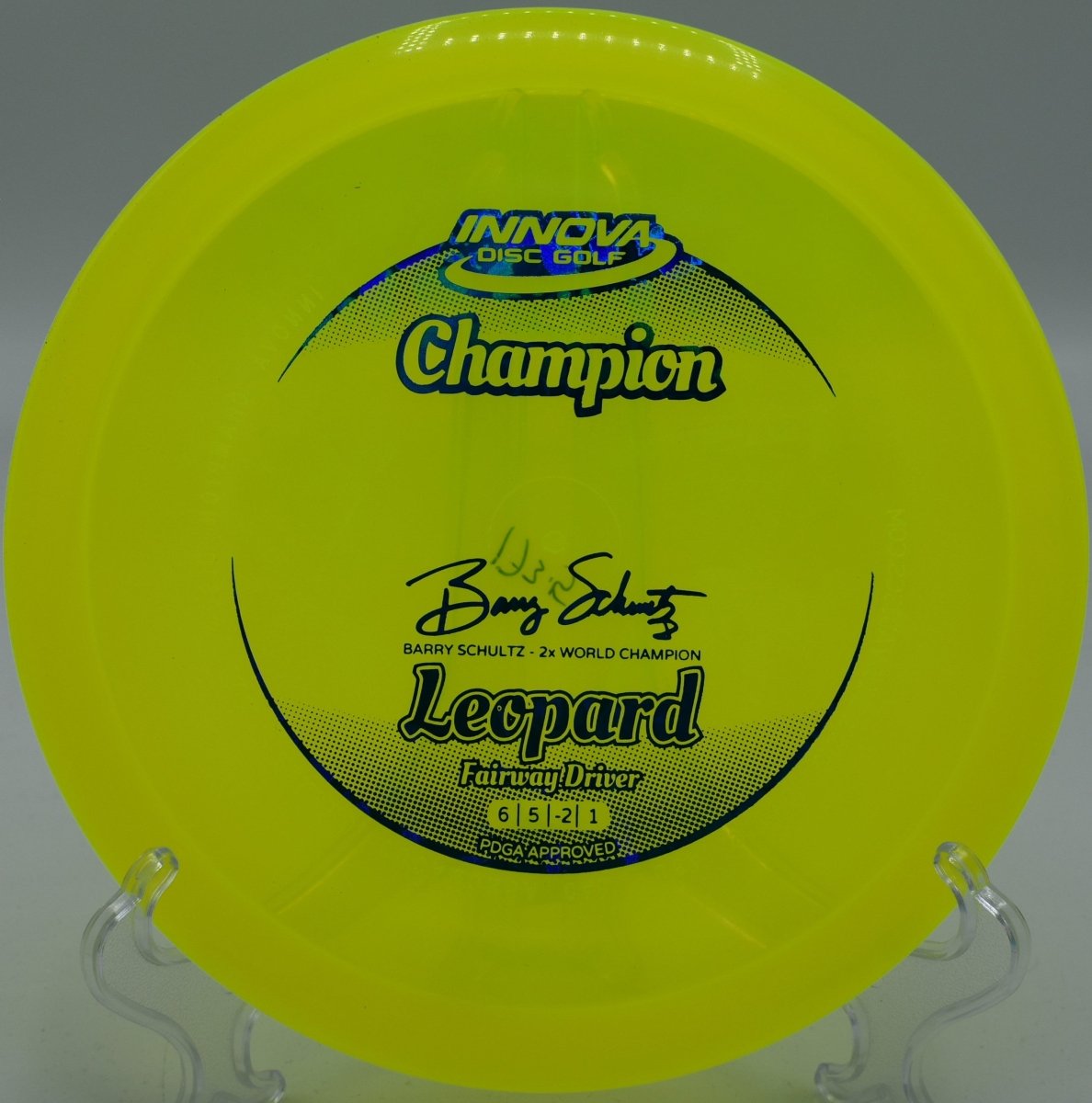 Innova Champion Leopard fairway driver carving a smooth hyzer flip through wooded fairway at Hobbs Farm Disc Golf Course in Carrollton, Georgia