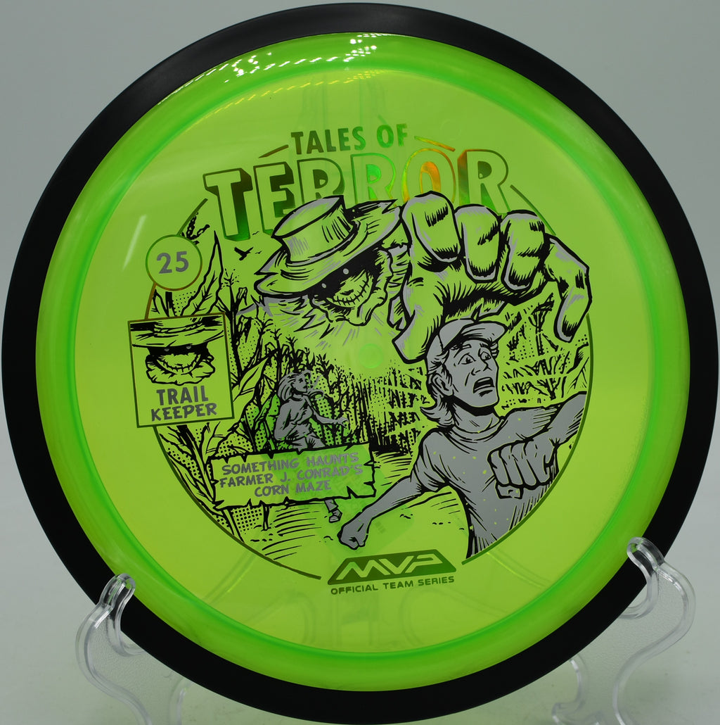 MVP Trail disc glowing with Halloween art, used for a soft standstill backhand at Bud Pell at Ross Farm in Bremerton, Washington.