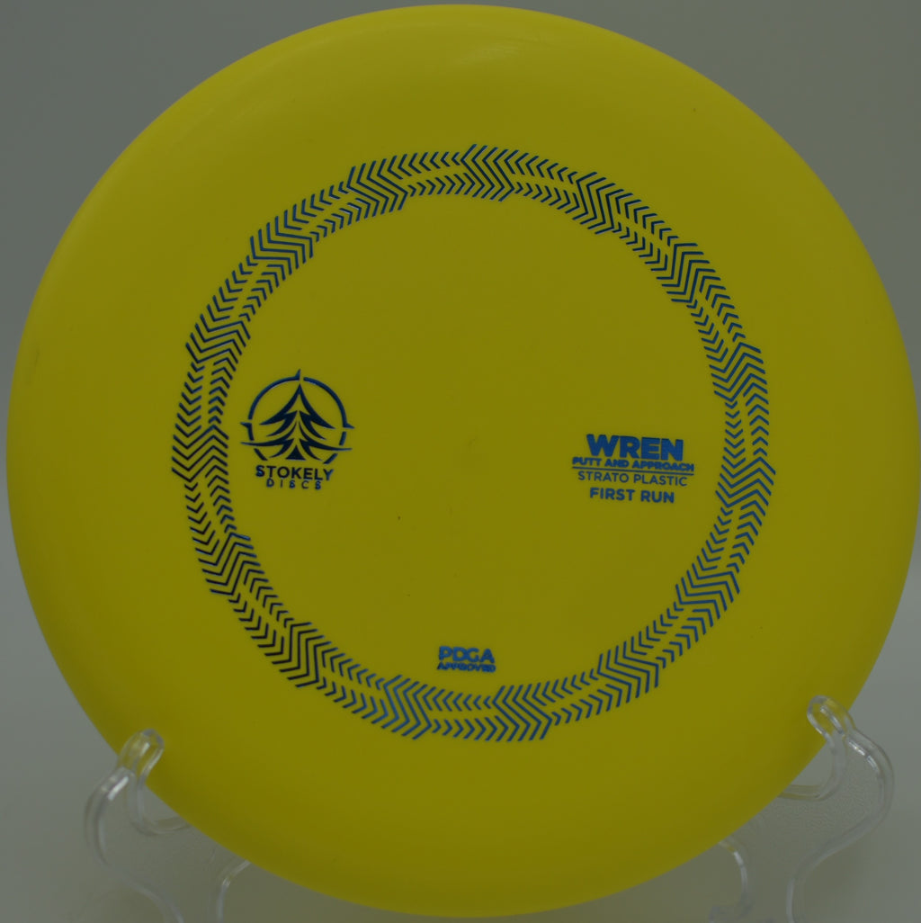 Player lining up a confident circle putt with the Strato Wren at Flip City Disc Golf Course in Shelby, Michigan.