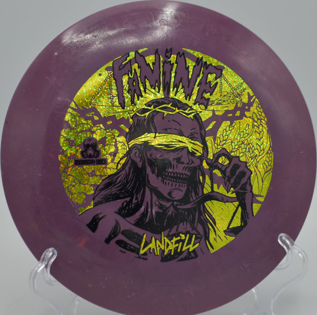 Doomsday Landfill Famine floating a smooth distance drive at McCurry Park DGC in Fayetteville, GA, riding a controlled turnover to circle-easy range.