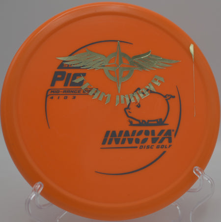 Player flicking a Soft Pro Pig Team Stamp forehand upshot toward the basket at Blue Ribbon Pines Disc Golf Course in East Bethel, Minnesota.