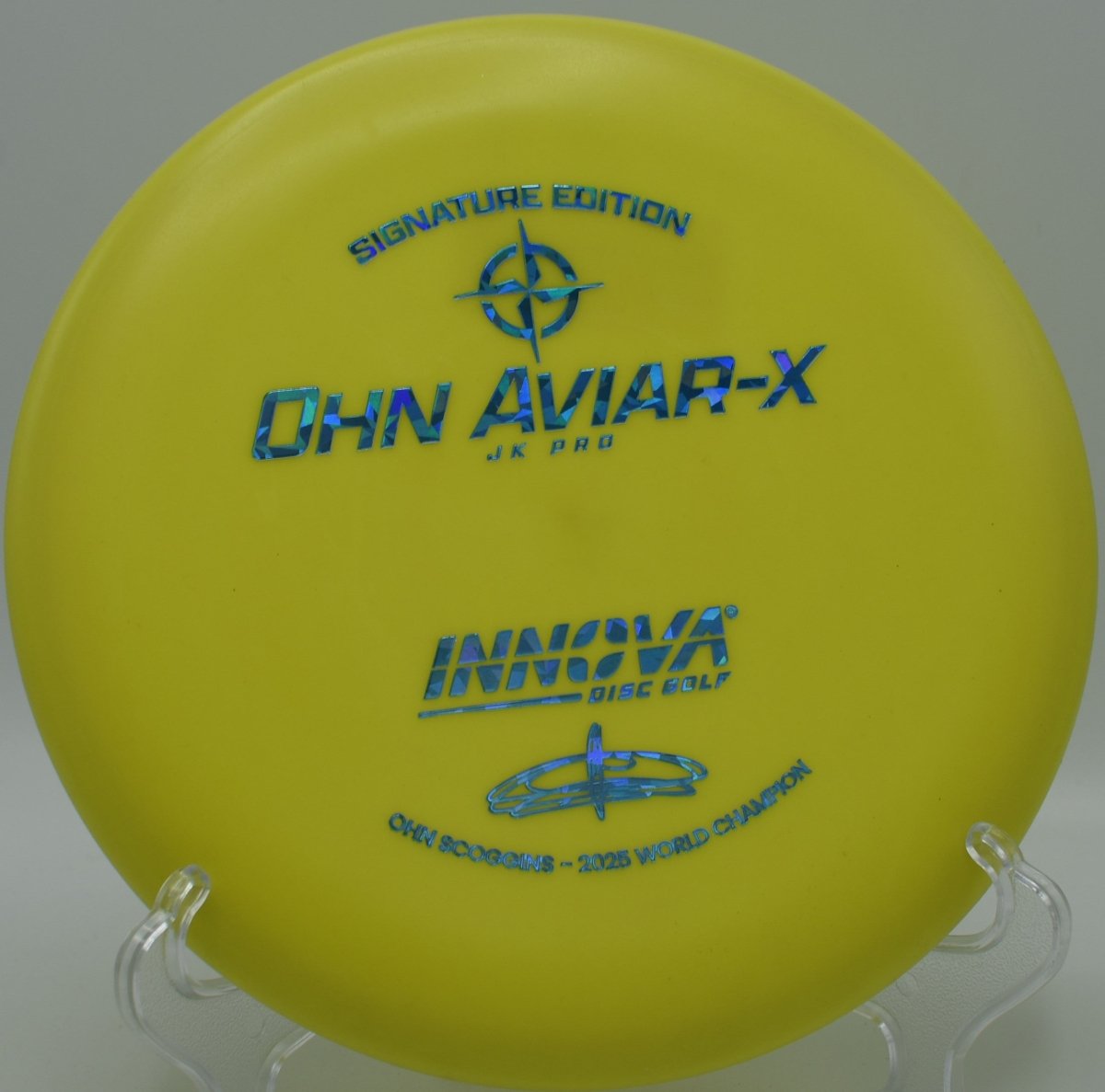 JK Aviar-X putter resting near chains after a glidey upshot at Maple Hill Red Course Disc Golf Course in Leicester, Massachusetts