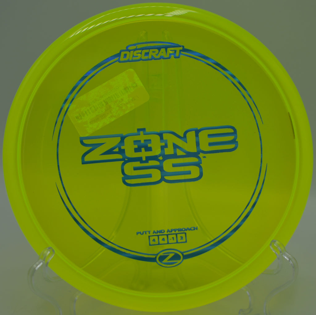 Discraft Z Zone SS flying over a downhill green at Santa Maria Disc Golf Course in Santa Maria, California.