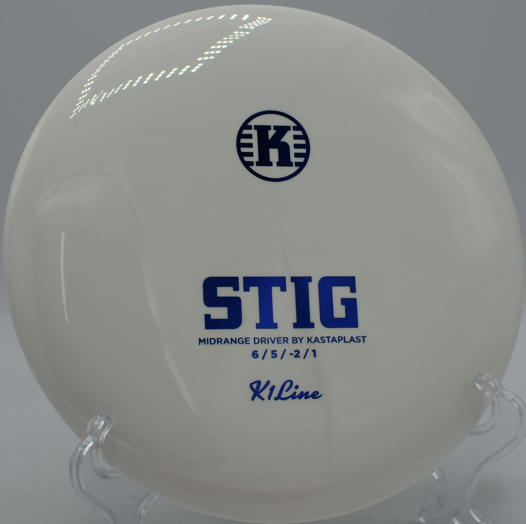Stig in premium K1 plastic resting beside the basket at The Canyons DGC in Lockport, Illinois, ideal for controlled approach shots.

