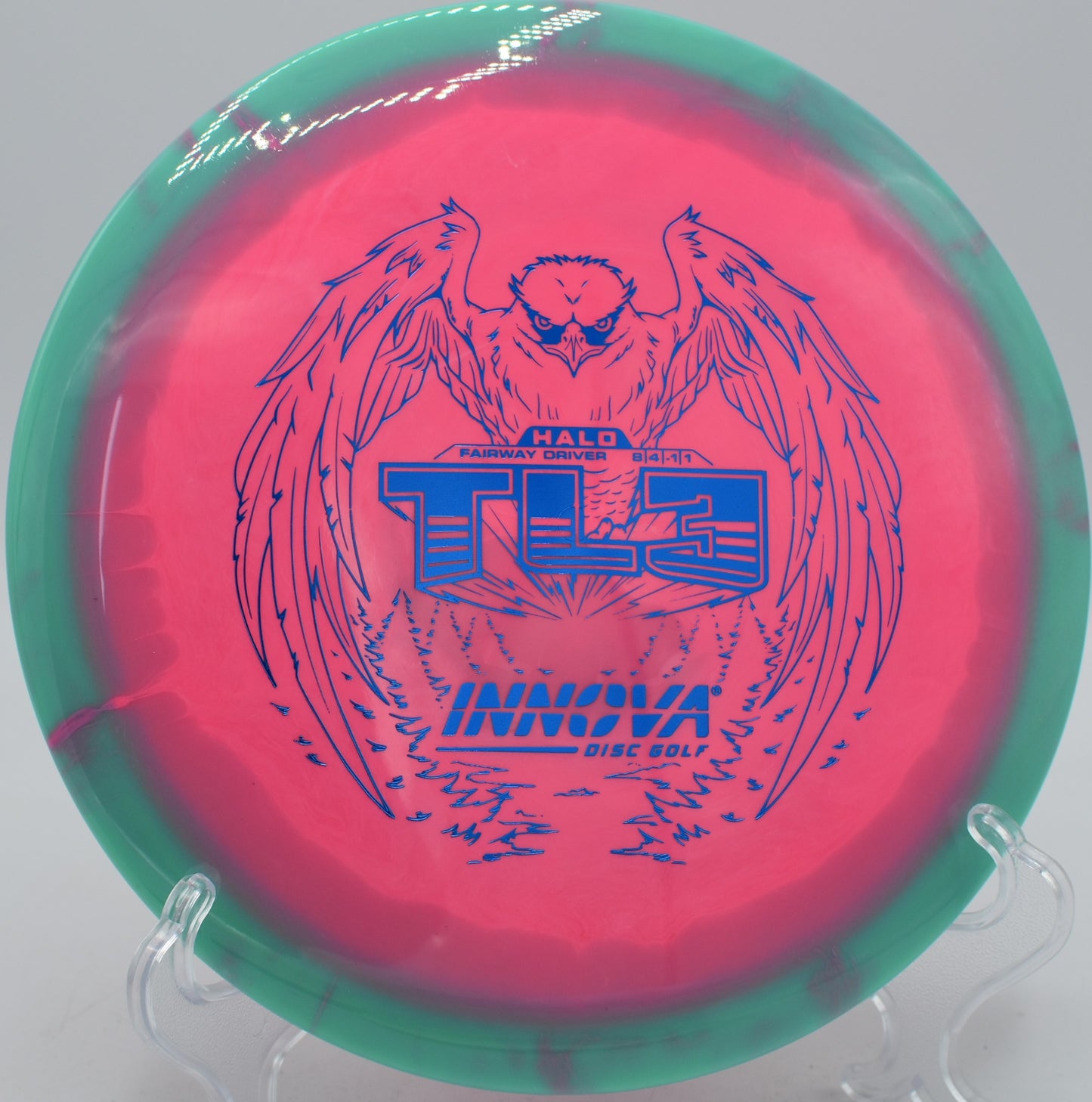 Innova Halo Star TL3 disc holding a straight hyzer-flip at Blue Ribbon Pines Disc Golf Course in East Bethel, Minnesota