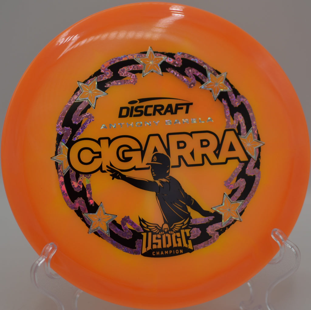 Discraft Cigarra Z-Swirl set on a rocky hillside at Vista del Camino DGC in Scottsdale, AZ, ideal for glide-driven distance.