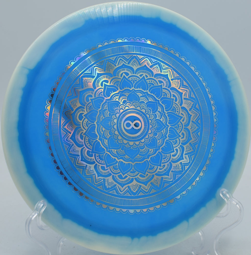 Infinite Discs Halo S-Blend Slab X-Out high-speed driver carving sharp fades at Water Works Park Disc Golf Course in Kansas City, Missouri.