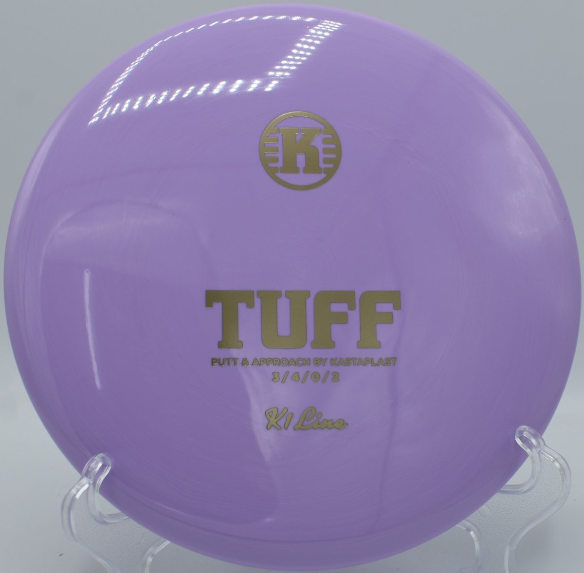 Kastaplast K1 Tuff putter positioned for a straddle putt at Dretzka Park Disc Golf Course in Milwaukee, Wisconsin