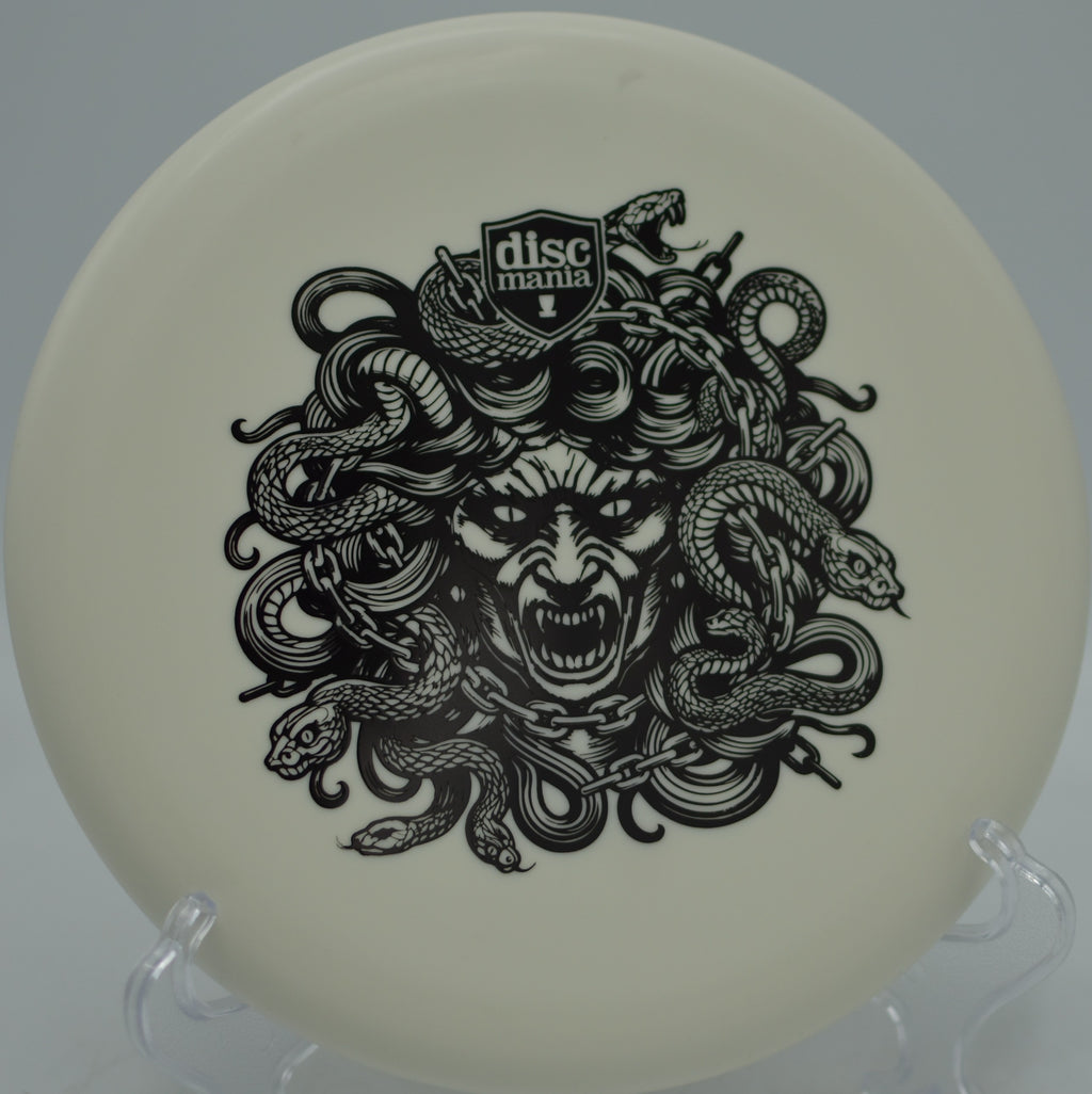 Soft Lumen Link Medusa Discmania glow putter landing dead straight at Persimmon Ridge Disc Golf Course in Greenbrier, Arkansas.