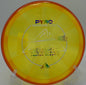 A player lining up a throw with the Prism Proton Pyro on the fairway at Hornet’s Nest Disc Golf Course in Charlotte, North Carolina, showcasing its power and consistency.