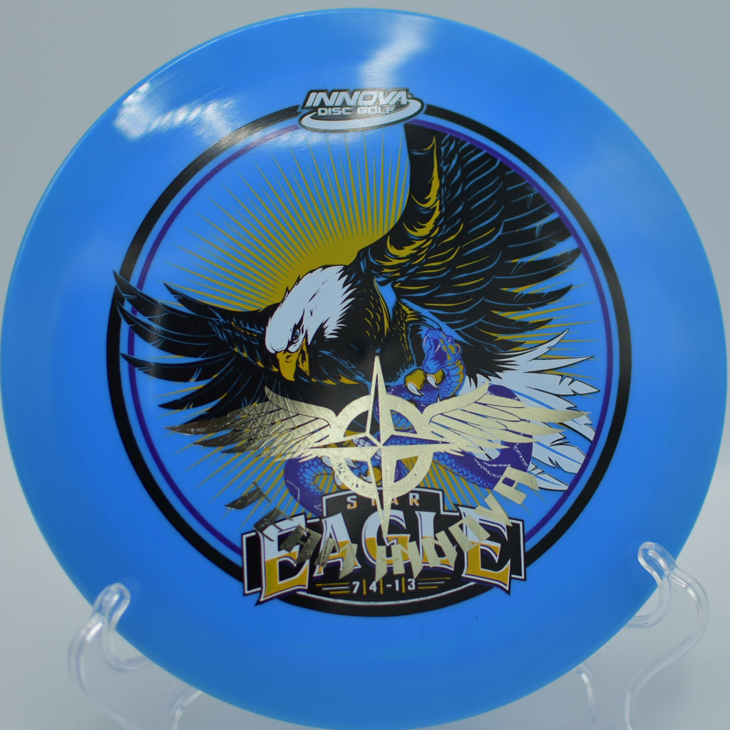 Player throwing an Innfuse Star Eagle Team Stamp on a controlled hyzer drive at Hornets Nest Disc Golf Course in Charlotte, North Carolina.