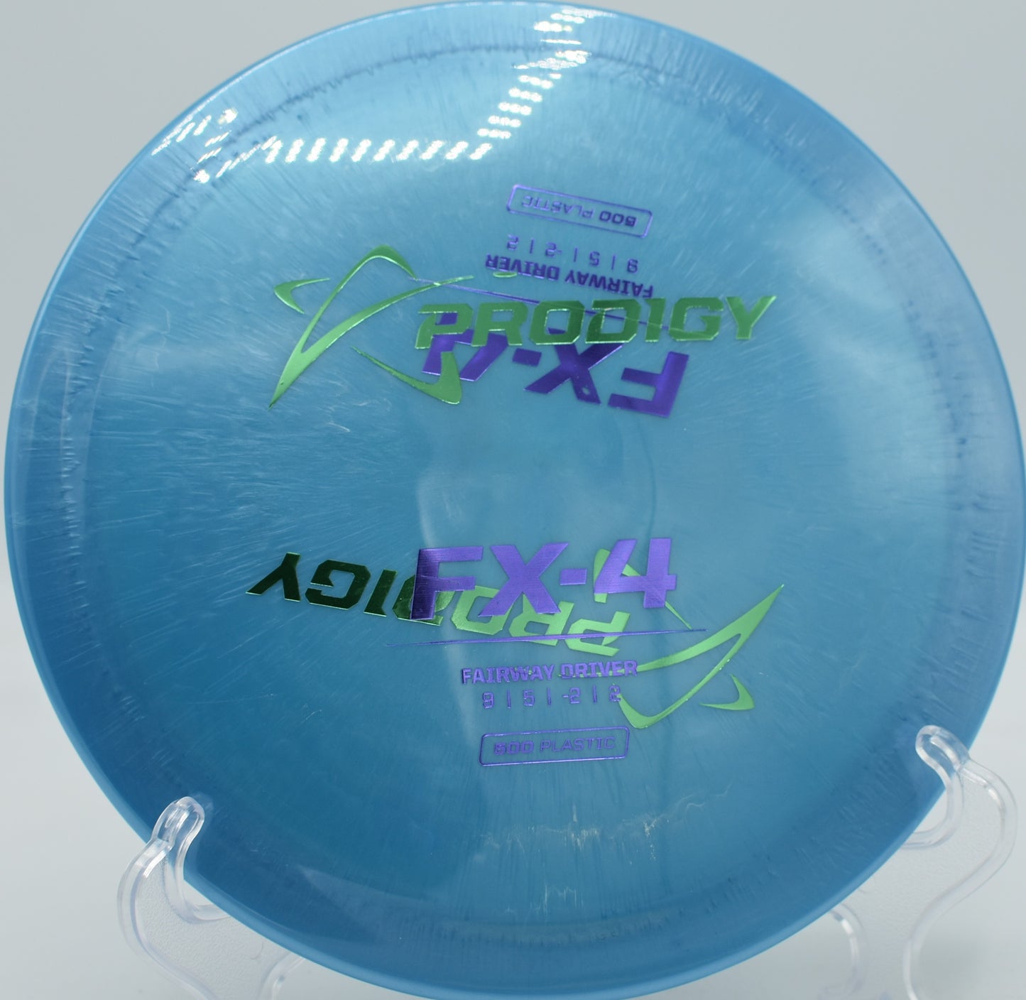 Factory Second Prodigy FX-4 in 500 Plastic gliding down a wooded fairway at The Blockhouse Disc Golf Course in Spotsylvania, Virginia.