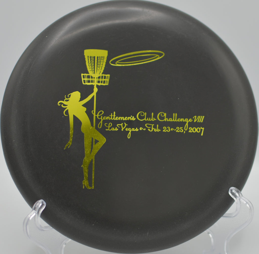 Pat# DX Aviar sinking a clean putt at Waterworks Park Disc Golf Course in Kansas City, Missouri, framed by rolling green hills and early morning fog.