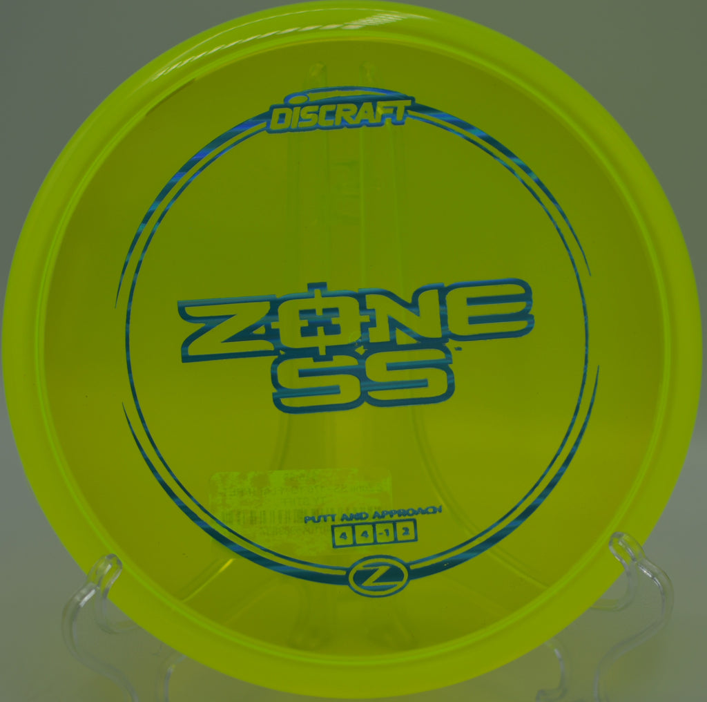 Controlled forehand flick with the Z Zone SS beside the basket at Orangevale Park Disc Golf Course in Orangevale, California.