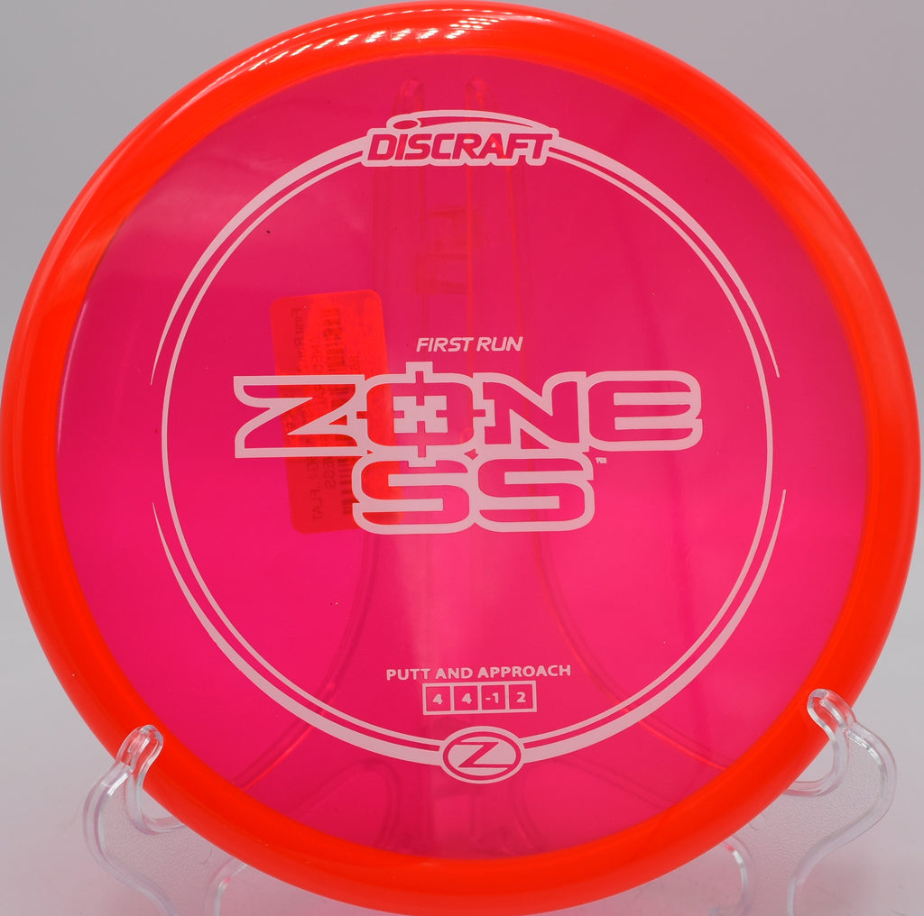 Discraft First Run Z Zone SS flexing through trees at Forest Hills DGC in Great Falls, MT
