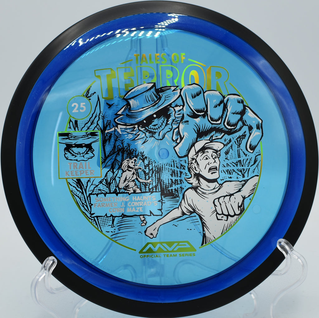 MVP Proton Trail Halloween disc soaring across the open fairway at Eagles Crossing Disc Golf Course in Missouri.