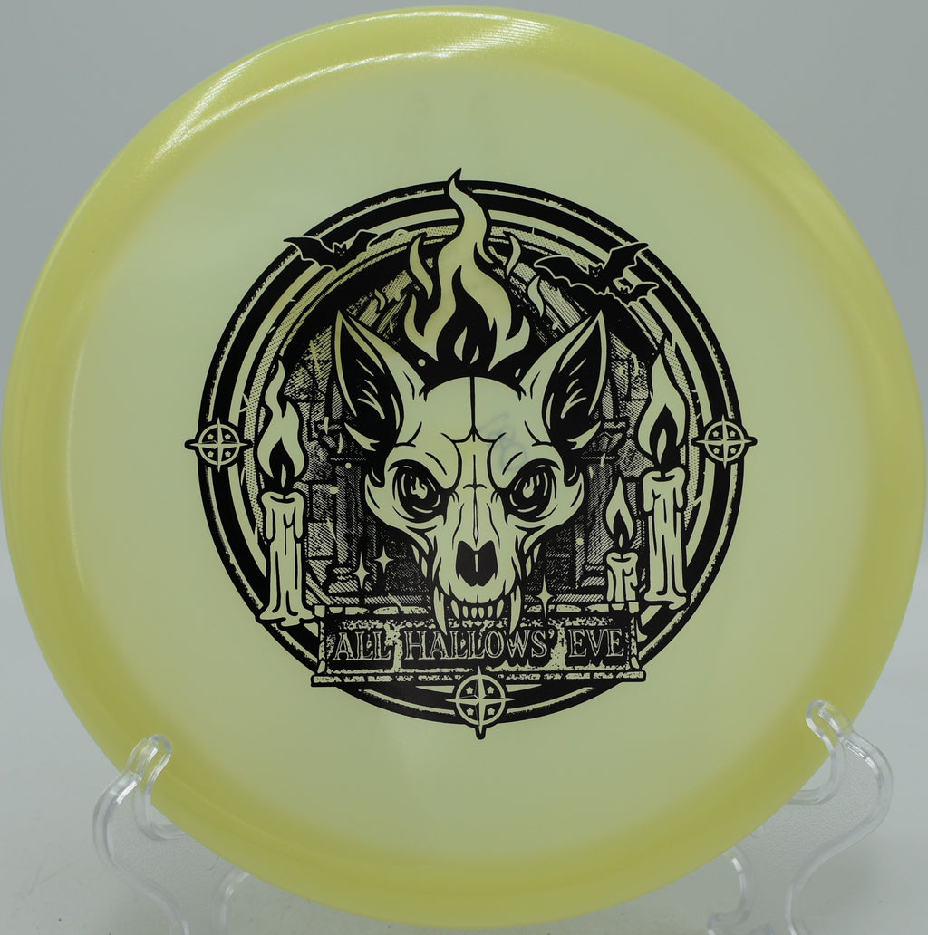 Innova Proto Glow Champion Fox understable driver gliding through woods at Nevin Disc Golf Course in Charlotte, North Carolina