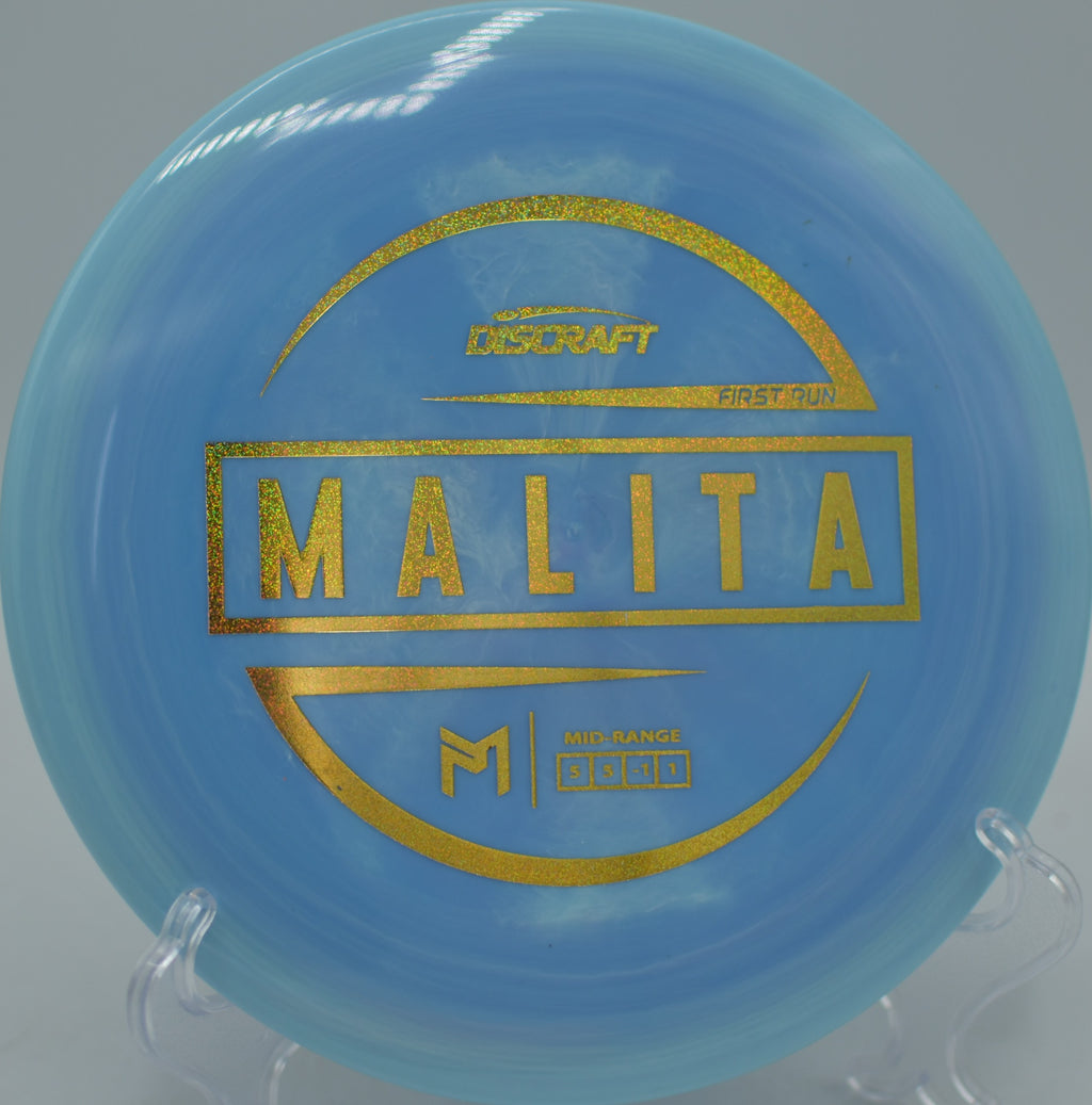 Player releasing a Discraft Malita for a standstill control shot at Lake Casitas Disc Golf Course in Ventura, California.