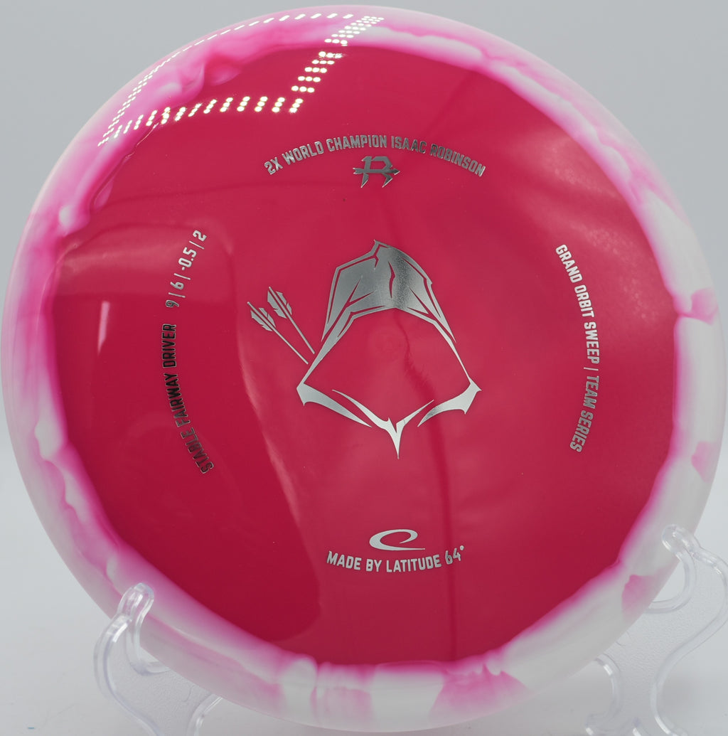 Grand Orbit Sweep Isaac Robinson Team Series 2025 gliding through a tunnel shot at Maple Hill Disc Golf Course in Leicester, Massachusetts, delivering elite glide and reliable fade.

