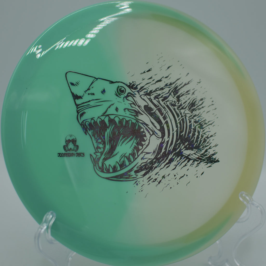 Doomsday Discs Glow Chemtrail on a gravel tee at Reservoir Park DGC in Troy, NC, ideal for long, straight flight paths.