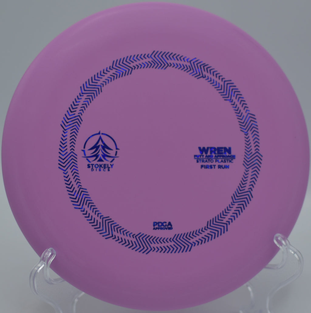 Stokely Discs Strato Wren spinning perfectly toward the basket at Deerfield Park Disc Golf Course in Mount Pleasant, Michigan.